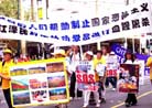 3/17/2002发表.墨尔本大法弟子游行集会抗议江泽民开枪令
