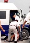 Published on 1/13/2001 Chinese plainclothes police lift a Falun Gong protester into a police van in Beijing’s Tiananmen Square July 22, 2001. Members of the spiritual [group], which is banned in mainland China, staged minor demonstrations during the second anniversary of China’s crackdown on the group