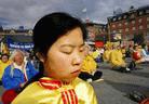 Published on 9/25/2002 AP Photo: [Practitioners] of Falun Gong meditate on City Hall Square Monday Sept. 23, 2002 in Copenhagen, Denmark during the ASEM Summit between leaders of Asia and the European Union.