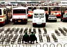Published on 10/6/2000 Policemen, army, and riot-prevention officers were everywhere in Beijing today. Patrolmen wearing steel helmets and armed with submachine guns were patrolling along the streets in three-wheeled motor vehicles. 10, 2001