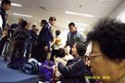 Published on 2/24/2003 Falun Gong practitioners illegally detained at the Hong Kong Airport. A policeman curses the practitioner whom he knocked down.
