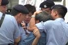 Published on 7/14/2002 Practitioners on Trial in Hong Kong -- Photos of the Arrest -- Who is Blocking Whom?
