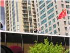 Published on 6/25/2003 Chicago: Chinese officials film Falun Gong practitioners passing by from rooftop of consulate (Photos)
