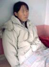 Published on 1/5/2003 Falun Dafa practitioner Li Jinghua has suffered a mental breakdown after being tortured extensively in the Masanjia Concentration Camp. Below is her story: 

Li Jinghua, female, 34, used to live in Lizhangzi Village, Zhaoduba Township, Longcheng District, Chaoyang City, Liaoning Province. In 1996, after she started to practice Falun Gong, her chronic illness was gone and she regained her health. Her husband joined the Falun Gong practice group and also experienced great health improvements. Her family had a harmonious life, but it didn’t last very long, as Jiang’s evil regime started the persecution against Falun Gong on July 20, 1999. As her family’s life was disrupted, with full trust in the rule of law, Li Jinghua made a decision to go to Beijing to tell the leaders of the country the facts about Falun Gong. She intended to share, through her own personal experience, the benefits of practicing cultivation. Because the authorities prohibited Falun Gong practitioners from buying train tickets to Beijing, Li and a fellow practitioner made the trip by bicycle. Later they were arrested and sent back to a local detention center. The authorities confiscated the family’s TV set, a cassette recorder and materials about Falun Dafa from her house. Because Li refused to renounce her belief in Falun Dafa, the authorities detained her on several different occasions and then abducted her to Xidayingzi for brainwashing. After one month in detention she still refused to compromise, so the authorities illegally sentenced her to one year of forced labor in the Masanjia Forced Labor Camp.

The Masanjia Forced Labor Camp is a place where Falun Gong practitioners suffer all kinds of tortures because they steadfastly refuse to betray their own conscience by renouncing their belief in Falun Dafa. Under the influence of such an oppressive environment, Li Jinghua was worn down after being severely abused both physically and mentally. In the Second Section, she was beaten because she continued to practice the Falun Gong exercises.

In January 2000 Li was transferred to the First Female Section for hard labor, where she was forced to make clothes, working under a very high requirement for quality and quantity. Laboring long hours every day and being cursed or beaten over failing to finish the required quotas, Li was under extreme mental pressure. The concentration camp authorities set Li’s regular work hours as from 6:30 a.m. to 10 p.m., with overtime lasting up to 3 a.m. when it was necessary to complete a certain quota. On one job destined for overseas export, she was forced to work continuously with no rest for thirty-six hours straight, missing two regular meals with no extra meals for overtime between the regular shifts. During the course of this grueling labor, for breakfast and dinner Li was only given a partially cooked steamed bun and a pickle, while lunch was just a small amount of rice. She was kept sandwiched between two inmates, who monitored her closely twenty-four hours a day, even when she went to the bathroom or ate meals. Li was forced to sleep between two inmates at night, in between two single beds.

In the middle of June 2000, the labor camp authorities ordered the practitioners in the First Female Section to halt their work in order to undergo brainwashing. More than twenty practitioners were forced to sit bunched up next to each other on benches in hot muggy weather, from 6:30 a.m. to 12 a.m., while the guards took them out individually for brainwashing. Because some practitioners refused to compromise, the guards beat them fiercely. Li and her fellow practitioners were surrounded by the guards’ cursing, the screams of the victims, and the sound of electric batons hitting flesh.

On July 6, 2000, Li Jinghua was detained in the First Female Section for brainwashing. Every day the collaborators [former practitioners who have turned against Dafa under intense pressure and torture] tried to brainwash her until midnight. To take away her freedom, they followed her wherever she went and forced her to eat her meals in her cell rather than in the cafeteria. After twenty more days of brainwashing, Li was physically injured and mentally worn down, but she still refused to compromise. Then the vicious policeman Zhang Yan forced her into an isolated small cell, where she was forced to remain in a bent over position for a long period of time. Meanwhile, two collaborators tortured her. Li Jinghua had to eat and relieve herself in the cell. As it was during the intense heat of summer, she suffered from the suffocating heat and countless mosquito bites. The collaborators made her hold this posture for seventy-two hours without sleeping, and cursed or beat her whenever they saw her moving even a little bit. After three days of torture, she was exhausted and looked like a shadow of her former self, but still she didn’t compromise. Utterly infuriated, the guards shocked her hands, feet, chest and neck with high-voltage electric batons. Witnessing her skin and flesh burned black under the electric shock, some onlookers couldn’t help but shed tears for her. As Jinghua was not in her right mind from this continual torture, the guard Zhang Yan forced her to write a guarantee statement to renounce Falun Gong. But after reading it, Zhang felt that this statement was not sincere and forced her to make a handwritten copy of the collaborators’ slanderous statements before releasing her from the small isolation cell. Knowing that Li’s statement was written against her own will, the guards had the collaborators continue to brainwash her.

After coming out from the small cell and having a short break, Li Jinghua quickly regained her righteous mind. When she declared the "guarantee" to be invalid and stated her resolve to continue Falun Dafa cultivation, Zhang Yan beat her right way and imprisoned her in the small cell again, where two collaborators forced her to hold the "flying dove" position for over two hours, until she lost consciousness. They then dragged her back and reported to the guards, Yang Yu and Zhang Yan. Yang roared, "Since she was still alright after bending over for three days and three nights, how could she fall unconscious within two hours? Is she playing games with me?" Yang pinched and hit her. It took quite a while before Li Jinghua regained consciousness. The perpetrators shifted her back into the small cell again and forced her to hold the same position for four days and four nights. Because Li firmly refused to compromise, the guards were at their wit’s end, and transferred her back to the Second Squadron of the first group for more hard labor.

When Li was sent back to the first group, her fellow practitioners saw the scars caused by the electric shocks on her chest and neck. She developed a terrible complexion and fell into depression. Li was beaten whenever she practiced the Falun Gong exercises. When Li’s one-year term in the forced labor camp expired, the authorities extended it indefinitely because she refused to renounce her belief. She started a hunger strike to resist the persecution and refused to take part in any more slave labor, so the wicked police shocked her with electric batons. Every morning she was taken away somewhere and sent back at night. Upon coming back, she stared blankly and talked to nobody. Several days later she suffered a mental breakdown. She became incontinent and left her clothes just lying in a tub of water. Later she was sent to a mental hospital in Shenyang City. Her family had to take care of her there and pay the entire 4,000 Yuan medical fee [500 Yuan is the average monthly salary for an urban worker in China]. She was sent back home in May of 2001 and has still not recovered.

A good person has been tortured into a state of mental collapse under the tyranny of Jiang’s regime. Her happy family life has been destroyed by the persecution. Good people have been deprived of their fundamental human rights by Jiang’s dictatorship. They are tortured for speaking the truth and punished for being good people.
