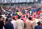 Published on 3/15/1997 Large scale group practice draws spectators,Guiyang City, Guizhou Province, March 1997.