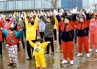 Published on 3/15/1997 Guiyang City Practitioners do Exercise Three on a rainy spring da in March,1997