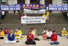 Published on 7/15/2003 Falun Dafa practitioners in Vancouver send forth righteous thoughts during July 2003 activity to "Expose the Evil and End the Persecution."