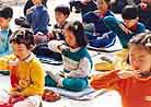 Published on 1/1/1997 Young Falun Dafa disciples in Beijing practice Exercise Five in the People’s Cultural Center after school, 1997.