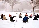 Published on 2000 Falun Dafa practitioners in Washington DC sit in meditation during morning practice in the snow, 2000.