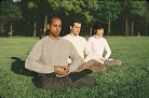 Published on 1/7/2002 Three Falun Gong practitioners practice exercise five in a park, 2002.