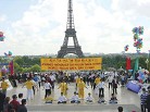 Published on 11/18/2004 Falun Gong practitioners exercise in front of the Eiffel Tower to celebrate World Falun Dafa Day in Paris, France, May 2002. 