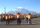 Published on 1/1/2000 Falun Dafa practitioners in Japan practice Exercise Three with Mount Fuji in the background, 2000.