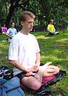 Published on 5/17/2000 Male Falun Dafa practitioner sits in meditation during group practice in New York City, 2000.
