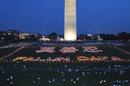 Published on 7/20/2001 Falun Gong practitioners hold a candle light vigil in Washington DC, forming the characters meaning "Truthfulness, Benevolence, Forbearance," 2001.
