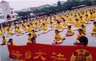 Published on 6/15/2002 Young Falun Dafa diciples in Chuanghua County, Taiwan, demonstrate Exercise Five during celebration of the 100th anniversaryof Hsihu Primary School’s founding, June 2002. 