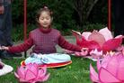 Published on 10/5/2003 A young practitioner in Australia meditating during "Petals of Peace" global event to help improve children’s understanding of Falun Dafa in October, 2003. 