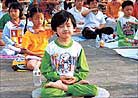 Published on 1998 Young Falun Dafa practitioners sit in meditation during Experience Sharing Conference for Little Practitioners in Guangzhou, southern China, 1998.