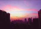 Published on 12/29/2001 On December 25, 2001, around 6 pm,a magneficent sunset glow manifested and painted the Guangzhou city with a charming violet color. According to experts, this is a very rare phenomena in Guangzhou during winter. However, everything happens with reason though human being may not discover it yet. In the past years, many practitioners in Guangzhou have been severely persecuted and even killed.   