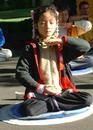 Published on 5/14/2001 During World Falun Dafa Day, a little practitioner is demonstrating exercise five, the meditation.