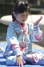 Published on 11/18/2004 A Texas newspaper published this photo: a child is practicing Falun Gong, the fifth exercise.