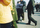 Published on 1/6/2002 一位残疾女大法弟子打横幅时被邪恶的便衣抓走