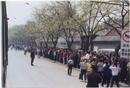 Published on 4/20/2001 Falun Gong practitioners waiting quietly for a just decision by Central Government officials on April 25, 1999. Police led the practitioners to Fuyou Street near Zhongnaihai, the government compound. 
