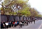 Published on 4/24/2004 Falun Gong practitioners waiting quietly for a just decision by Central Government officials on April 25, 1999. Police led the practitioners to Fuyou Street near Zhongnaihai, the government compound. 
