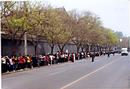 Published on 4/24/2000 Falun Gong practitioners waiting quietly for a just decision by Central Government officials on April 25, 1999. Police led the practitioners to Fuyou Street near Zhongnaihai, the government compound. 
