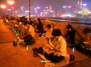 Published on 4/18/2001 Practitioners in Hong Kong expressed their solidarity with their fellow practitioners around the world during the global candlelight vigil on April 17th. They had one gathering on Hong Kong island and another in a seaside park in Kowloon, sending out their call for international support across the water.