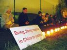 Published on 12/12/2003 Latvia Falun Gong Practitioners Holding a Candlelight Vigil on World Human Rights Day Appealing for a Trial of Jiang Zemin, Perpetrator of the Persecution on December 10, 2003
