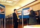 Published on 12/3/2001 On November 26,2001,the "Journey of Falun Dafa" photo exhibit was held in the Civic Center of Cambridge. On display were over 200 activity photos of Falun Gong practitioners in England.
