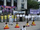 Published on 7/23/2003 On July 20, which marked the fourth anniversary of Jinag Zemin regime’s persecution of Falun Gong, some practitioners held a news conference in downtown, calling for justice and conscience in the world and requesting to bring Jiang Zemin to public trial and to stop the persecution against Falun Gong.
