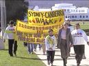 Published on 7/22/2001 Canberra ACT Kery Tucker walks to the Parliament with Australian practitioners participating in SOS Urgent Rescue events on July 20, 2001.