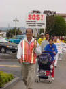 Published on 9/19/2001 Falun Dafa practitioners walk through a small town during the SOS! Global Rescue Walk from Seattle to San Francisco, USA in September 2001.