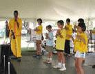 Published on 9/12/2001 On 9/8/01 and 9, under the Washington DC Memorial, participants of an African-American Family Day Festival found a peaceful Falun Dafa booth. One African-American couple devoted lots of time for this Hongfa activity. During the two-day event, many people came to know Dafa, as they accepted the Dafa materials and learned the exercise. Many people also signed the petition to support Falun Gong and free Dr. Teng Chunyan.