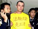 Published on 12/21/2000 Falun Gong practitioner Tommas Robinson, from England arrested during Jiang Zemin’s visit to Macau, 2000.

