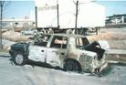 Published on 8/17/2003 American Falun Gong practitioner’s car was set on fire in a series of harrassment incidents, 2002.