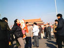 Published on 1/2/2002 Practitioners from Northeast China Unfurl banners at Tiananmen Square on New Year’s Day. Facing the brutal beating and arrest, a young woman practitioner with her baby fearlessly shouts "Falun Dafa is Good!" 

