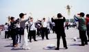 Published on 5/15/2000 Ten Falun Gong practitioners practiced the exercises near the flag pole at Tiananmen Square to celebrate the World Falun Dafa Day, May 13 2000.
