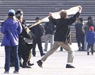 Published on 11/18/2004 Western practitioner unfurls banner at Tiananmen Square during peaceful appeal for Falun Gong (February 2002).