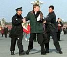 Published on 11/18/2004 Chinese Police arrest an American Falun Gong practitioner who made a peaceful appeal for Falun Gong at Tiananmen square. (2/2002)