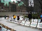 Visitors Viewing the 'Journey of Falun Dafa' Exhibition in Toronto during Celebration of  'World Falun Dafa Day' May 13, 2002