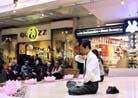 Published on 3/23/2002 Montreal Dafa Practitioners Spread the Fa and Clarify the Truth in Downtown Shopping Center 