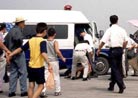 Published on 1/13/2001 Chinese plainclothes police detain a Falun Gong protester at Tiananmen Square in Beijing July 22, 2001. Members of the Falun Gong spiritual [group], which is banned in mainland China, staged minor demonstrations at Tiananmen Square during the second anniversary of the start of China’s crackdown on the group