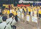 Published on 5/11/2001 Group practice in the rainstorm outside the Immigration Department on the afternoon of May 9 2001

