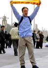Published on 4/15/2002 BEIJING (AP) - A young man identified as an American university student was taken into custody peacefully Sunday after unfurling a banner on crowded Tiananmen Square and shouting [statements] supporting the outlawed Falun Gong [group]. 


The man, identified by Falun Gong supporters in the United States as Andrew Muir Ellsmore, 21, was quickly driven off in a police van that had been stationed nearby -- standard operating procedure in the public square that represents the heart of Chinese communism. 
