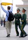 Published on 4/15/2002 BEIJING (AP) - A young man identified as an American university student was taken into custody peacefully Sunday after unfurling a banner on crowded Tiananmen Square and shouting [statements] supporting the outlawed Falun Gong [group]. 


The man, identified by Falun Gong supporters in the United States as Andrew Muir Ellsmore, 21, was quickly driven off in a police van that had been stationed nearby -- standard operating procedure in the public square that represents the heart of Chinese communism.