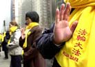 Published on 2/2/2002 AP Photo: Falun Gong practitioners petitioning during the World Economic Forum in New York. January 31, 2002