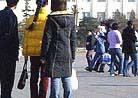 Published on 1/24/2002 Plainclothes agents and a uniformed officer lead away a foreign supporter, center, of the Falun Gong spiritual movement who protested Wednesday, Jan. 23, 2002, in Beijing’s Tiananmen Square against China’s ban on the group.

