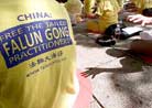 Published on 8/28/2001 Reuters Photo collection: Media Reports on DC Hunger Strike. Falun Gong followers practice meditation exercises outside the government headquarters in Hong Kong on August 24, 2001. About 100 Hong Kong disciples of the Falun Gong spiritual movement called for the release of practitioners kept in Chinese jails and labor camps and for an end to Beijing’s persecution on the group. (Kin Cheung/Reuters)

